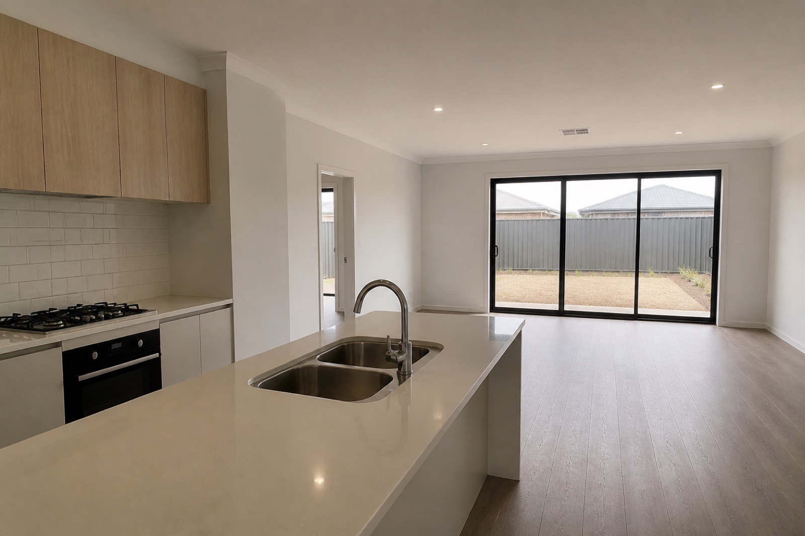 A finished kitchen at handover, empty and waiting
