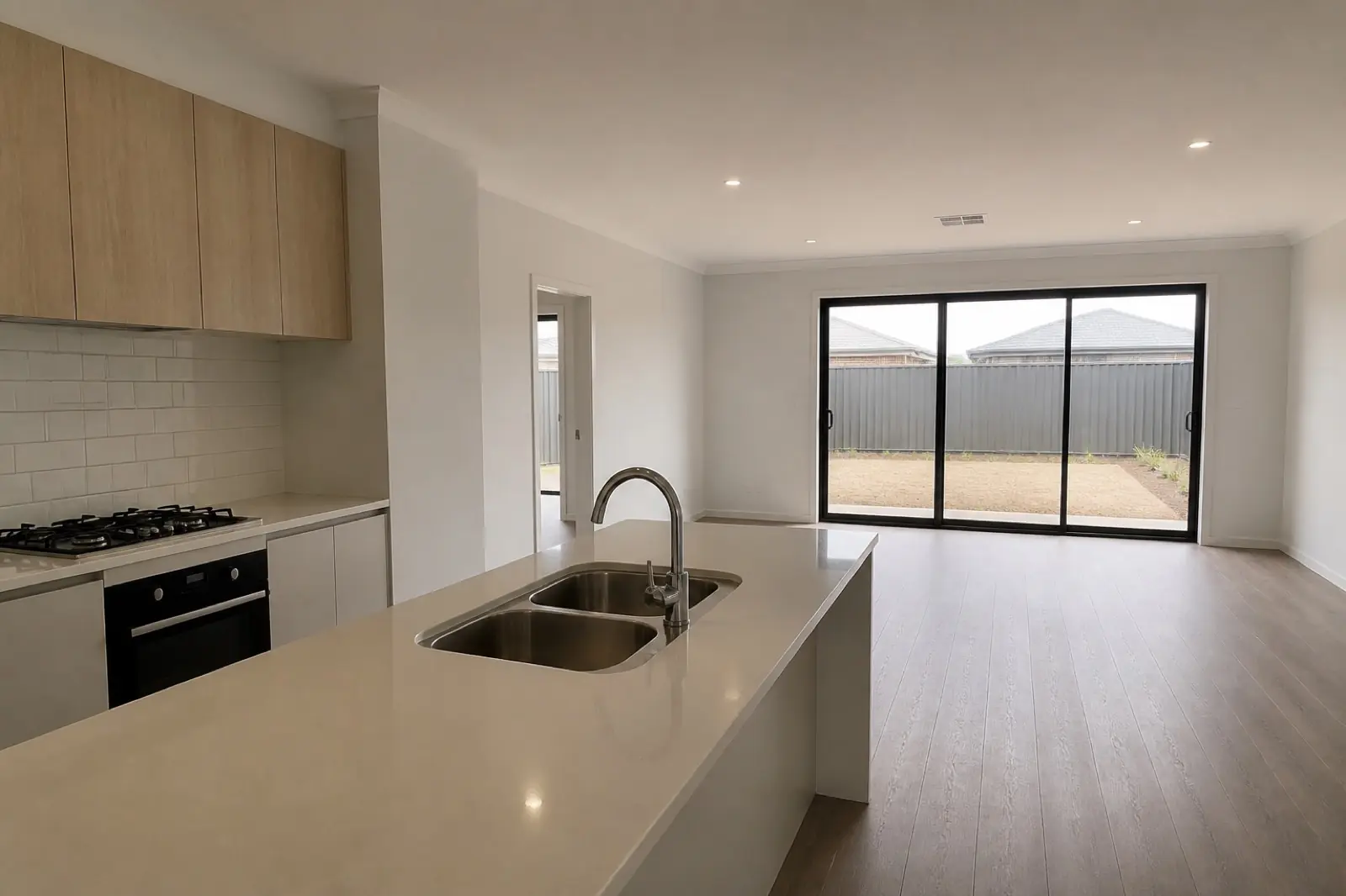 A finished kitchen at handover, empty and waiting